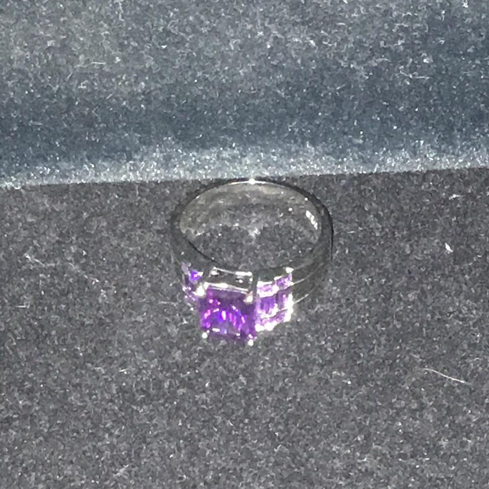 Sterling Silver and Amethysts.